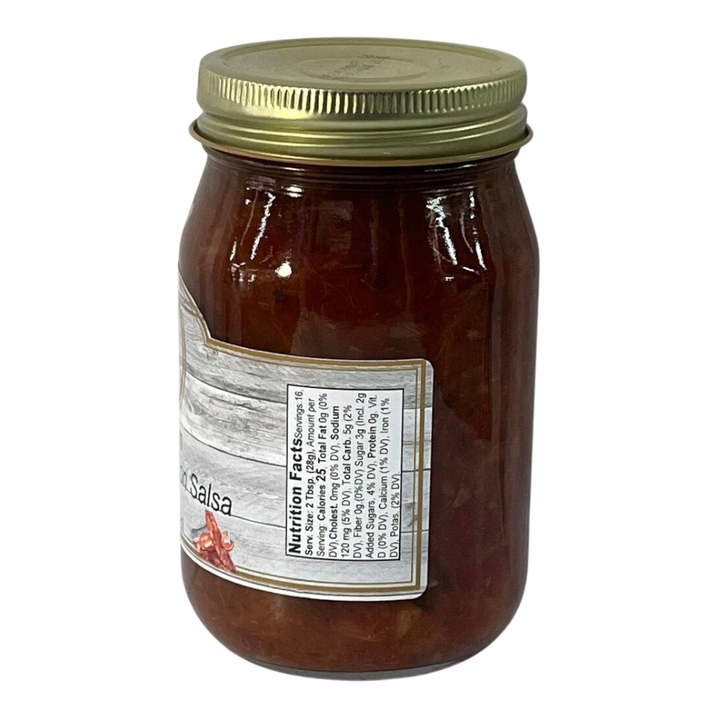 Broke Man's Pantry medium pineapple bacon salsa in a glass jar with a gold lid against a black background.