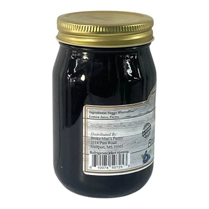 Broke Man's Pantry Blueberry Jam in a glass jar with a gold lid. All-natural ingredients.