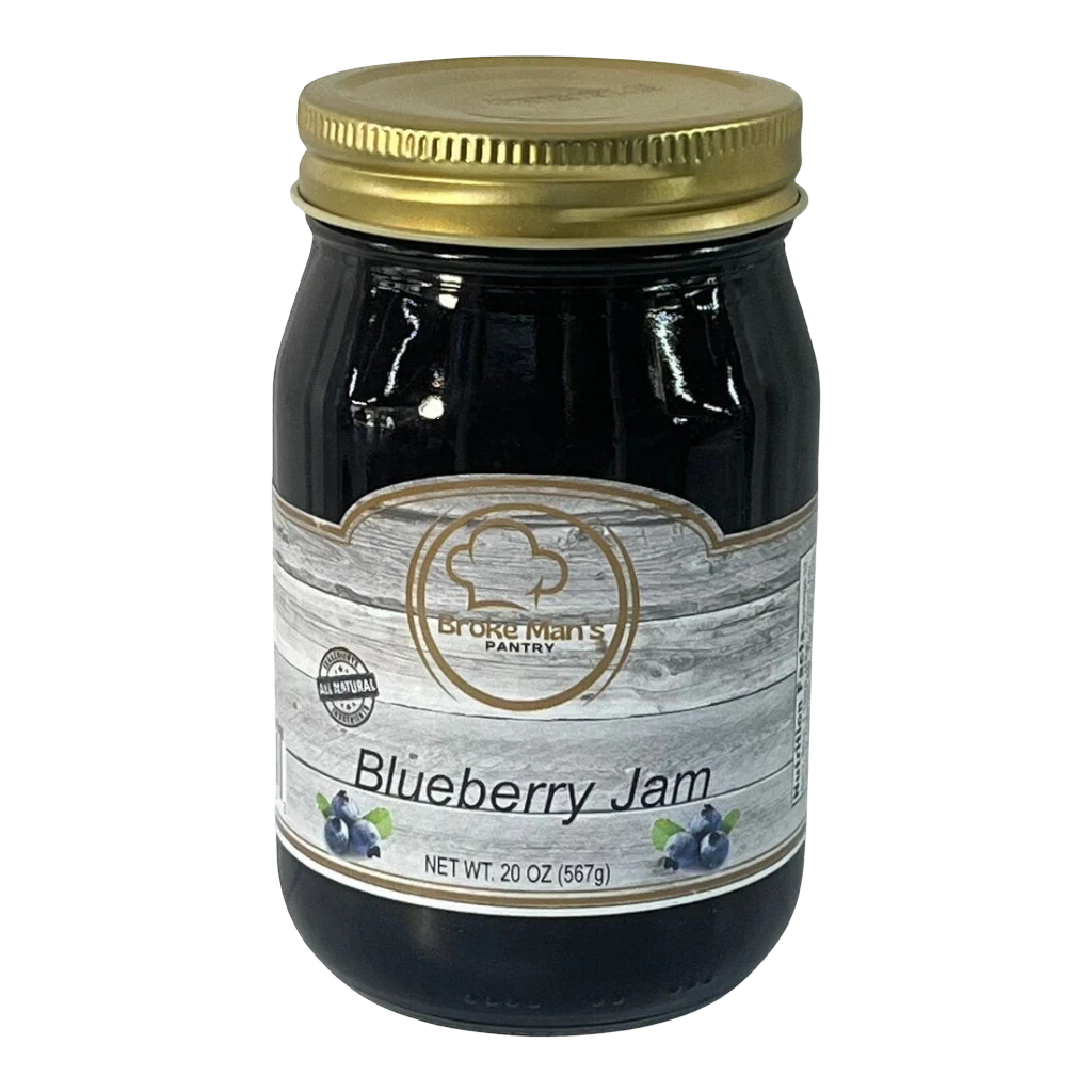 Broke Man's Pantry Blueberry Jam in a glass jar with a gold lid. All-natural jam with a smooth texture.