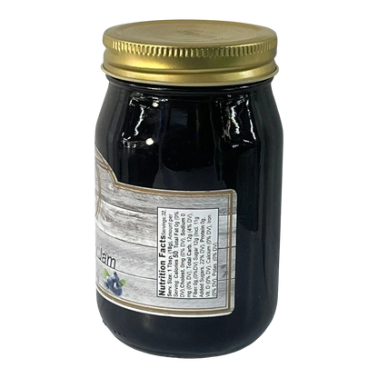 Broke Man's Pantry Blueberry Jam in a glass jar with a gold lid. Natural ingredients, smooth texture.