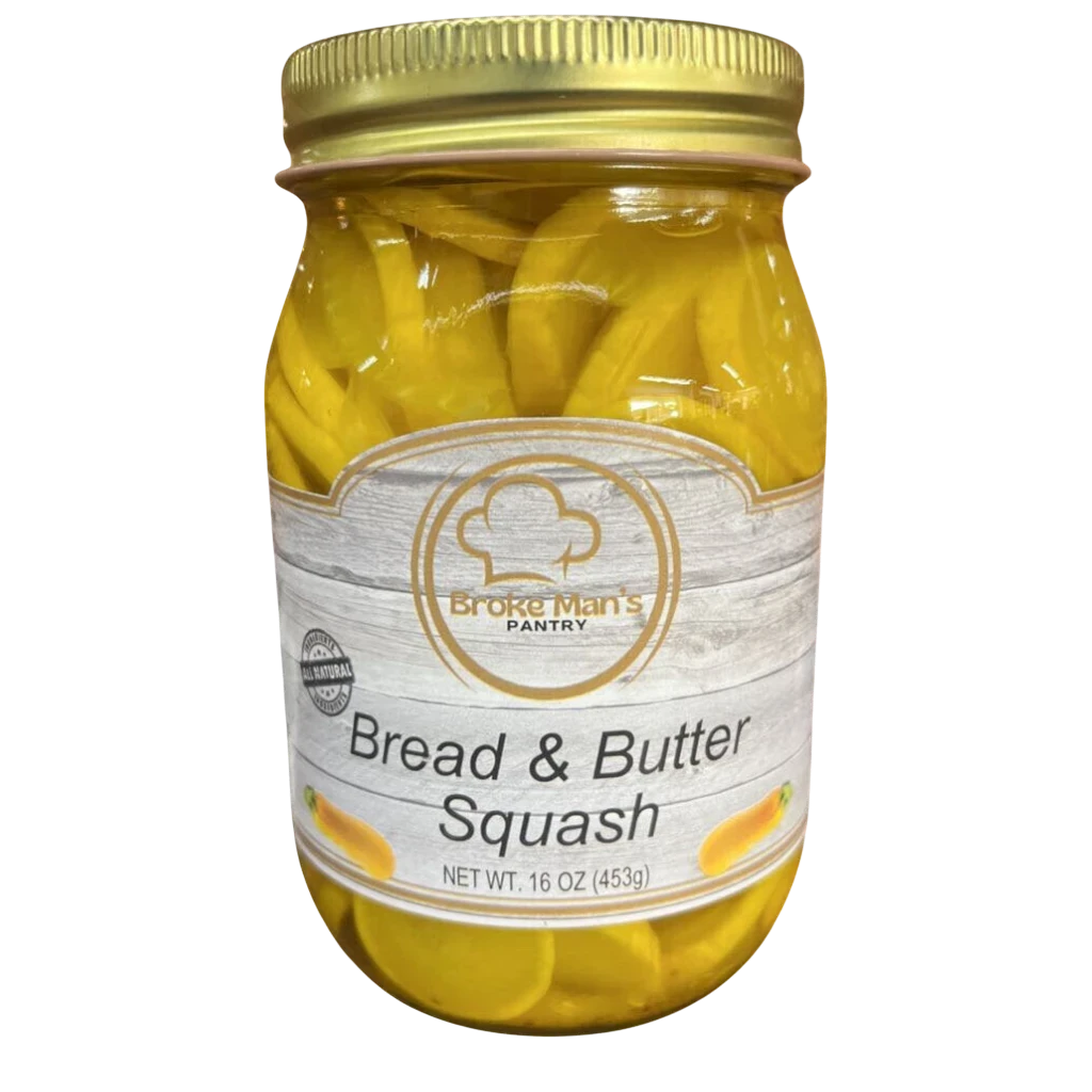 Broke Man's Pantry Bread and Butter Squash in a 16 oz glass jar with a gold lid, featuring sliced yellow squash.