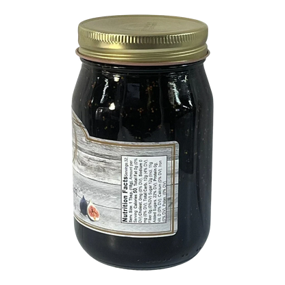 Broke Man's Pantry Fig Jam in a glass jar with a gold lid, featuring a rustic label with nutrition facts.
