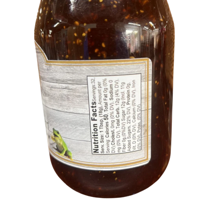 Broke Man's Pantry FROG Jam jar showing nutrition facts label with a small frog illustration on a wood-grain background
