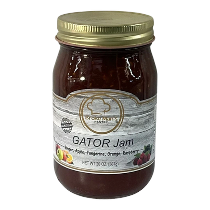 Broke Man's Pantry Gator Jam in a 20 oz glass jar with a gold lid, featuring ginger, apple, and berry fruit flavors.