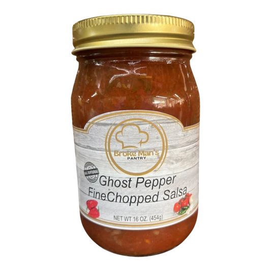 Broke Man's Pantry Ghost Pepper Fine Chopped Salsa in a 16 oz glass jar with a gold lid on a wooden surface.