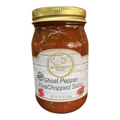 Broke Man's Pantry Ghost Pepper Fine Chopped Salsa in a 16 oz glass jar with a gold lid on a wooden surface.