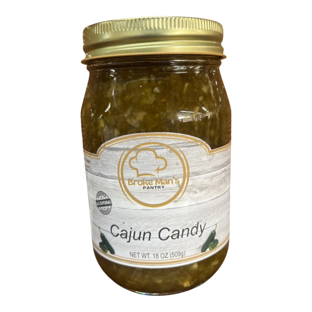 Broke Man's Pantry Jalapeño Cajun Candy in a glass jar with a gold lid, featuring a rustic label design.