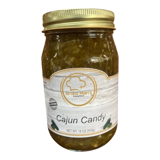 Broke Man's Pantry Jalapeño Cajun Candy in a glass jar with a gold lid, featuring a rustic label and green relish.