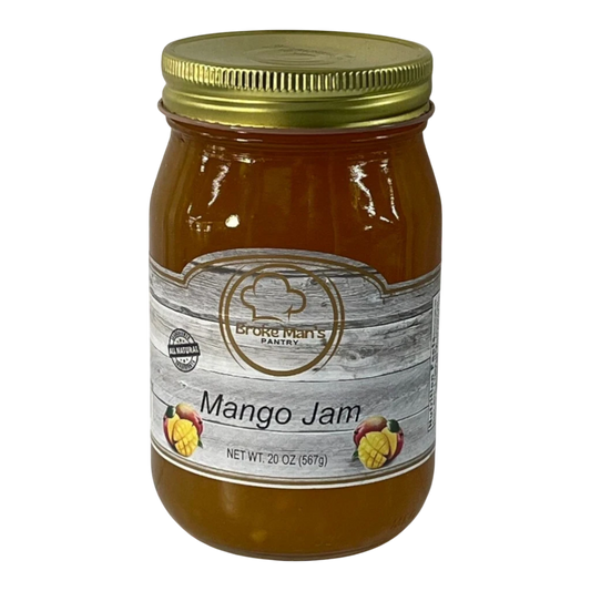 Broke Man's Pantry all-natural mango jam in a 20 oz glass jar with a gold lid and rustic wood-grain label.