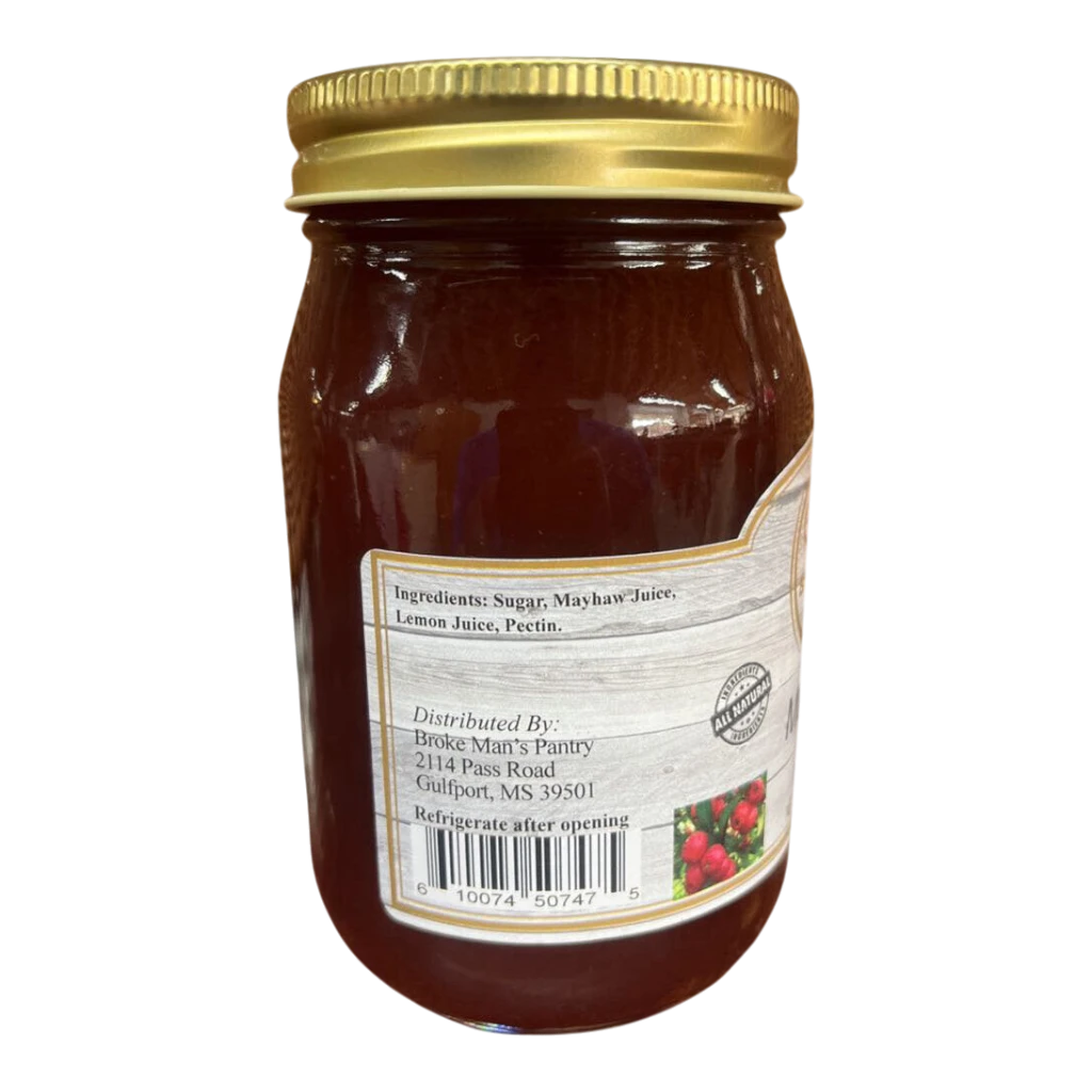 Broke Man's Pantry all-natural mayhaw jelly in a glass jar with a gold lid, featuring a rustic ingredient label.