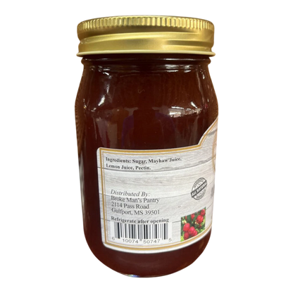 Broke Man's Pantry all-natural mayhaw jelly in a glass jar with a gold lid, featuring a rustic ingredient label.