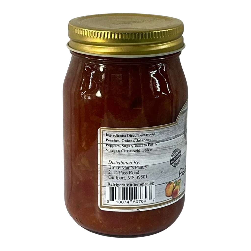 Broke Man's Pantry mild peach salsa in a glass jar with a gold lid, featuring natural ingredients and spices.