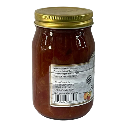 Broke Man's Pantry mild peach salsa in a glass jar with a gold lid, featuring natural ingredients and spices.