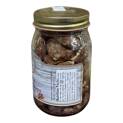 Broke Man's Pantry Praline Pecan Halves in a glass jar with a gold lid, featuring a rustic wood-grain label.