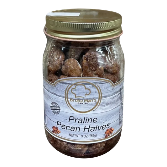 Broke Man's Pantry Praline Pecan Halves in a 9oz glass jar with a gold lid, featuring a rustic wood-grain label.