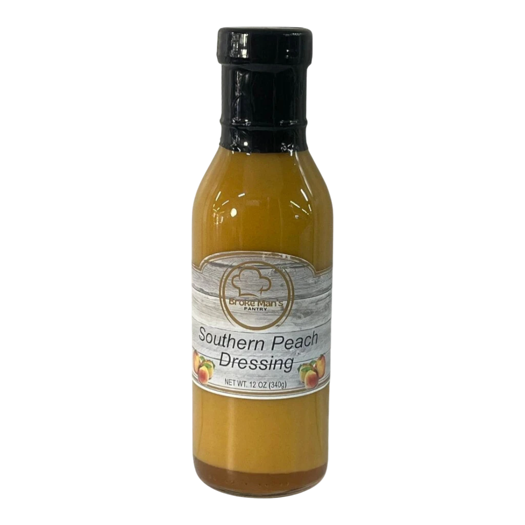 Broke Man's Pantry Southern Peach Dressing in a 12 oz glass bottle with a sweet and tangy golden peach puree blend.
