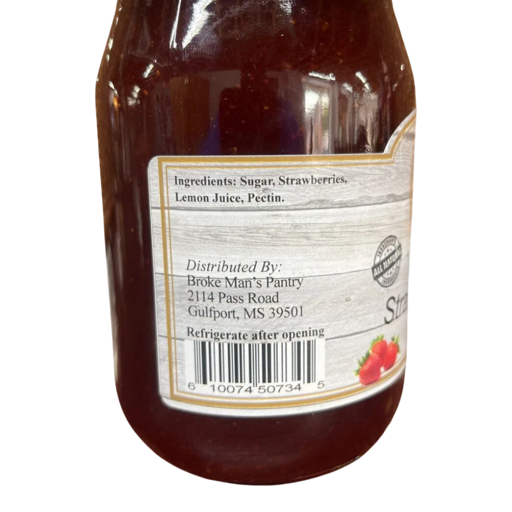 Broke Man's Pantry all-natural strawberry jam jar label showing ingredients and barcode on a black background.