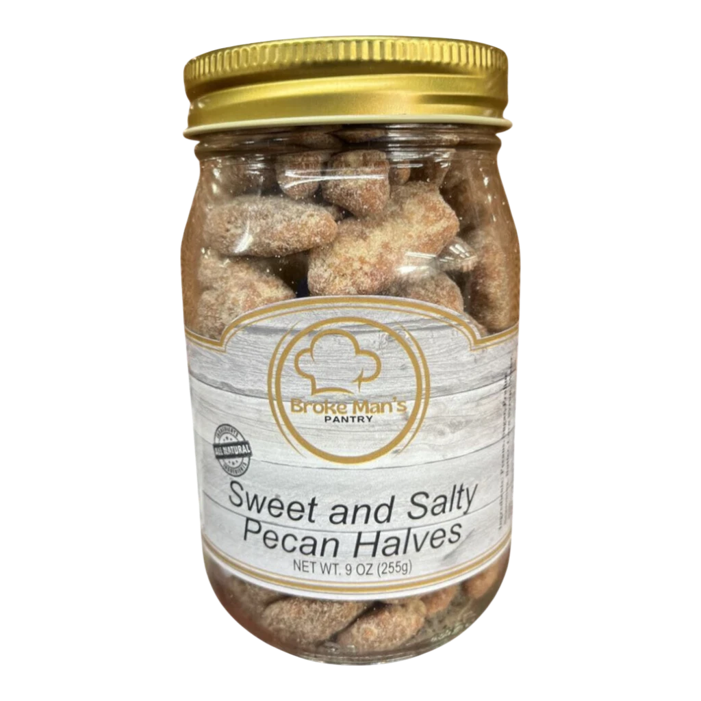 Broke Man's Pantry sweet and salty pecan halves in a glass jar with a gold lid, perfect for snacking.