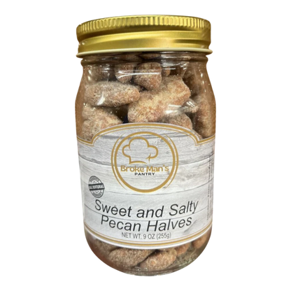 Broke Man's Pantry sweet and salty pecan halves in a glass jar with a gold lid, perfect for snacking.