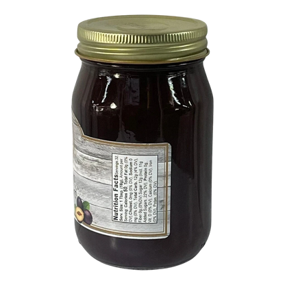 Broke Man's Pantry Damson Plum Jam in a glass jar with a gold lid, featuring a rustic label with nutrition facts.