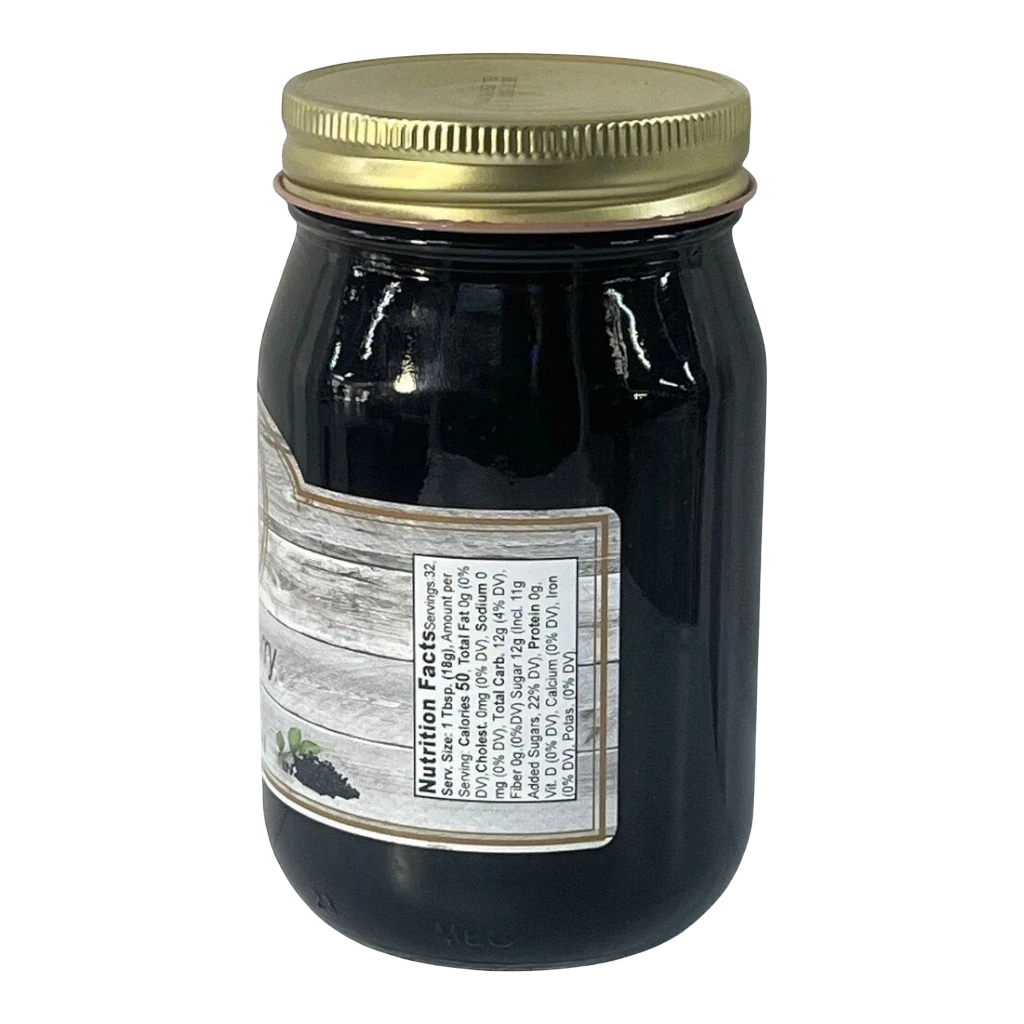 Broke Man's Pantry deep purple elderberry jelly in a glass jar with a gold lid and nutrition facts label.