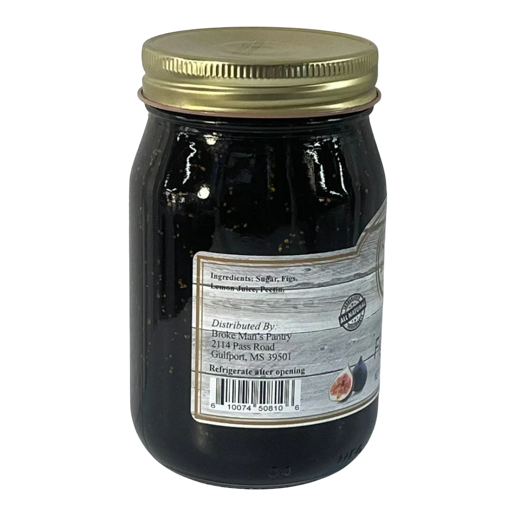 Broke Man's Pantry Fig Jam in a glass jar with a gold lid, featuring a rustic label with ingredient details.