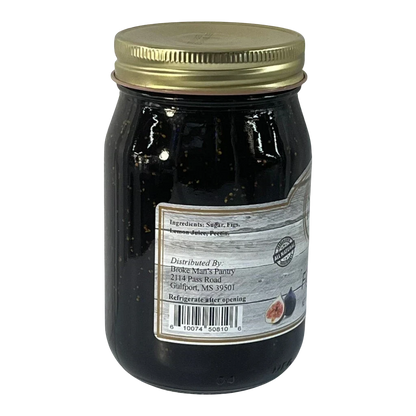 Broke Man's Pantry Fig Jam in a glass jar with a gold lid, featuring a rustic label with ingredient details.