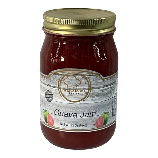 Broke Man's Pantry Guava Jam in a 22oz glass jar with a gold lid and rustic wood-grain label design.
