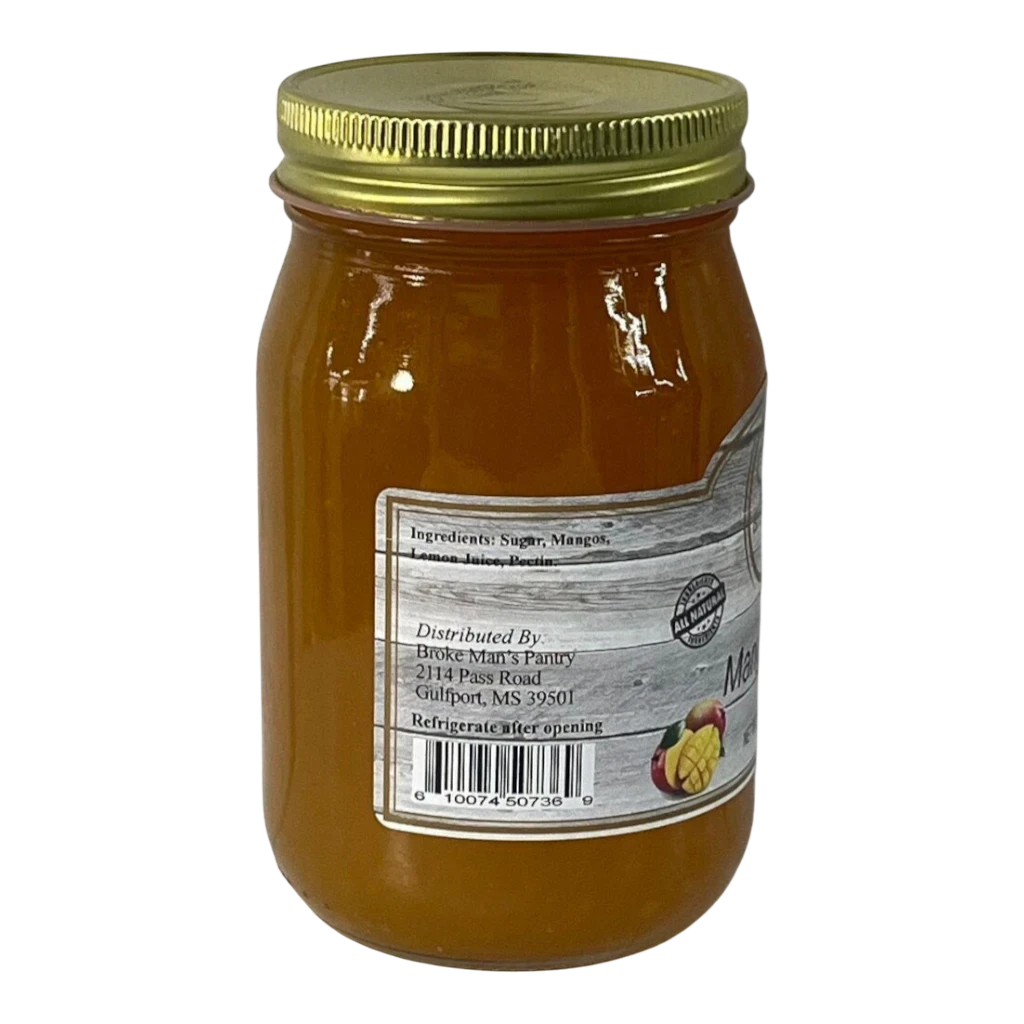 Broke Man's Pantry all-natural mango jam in a glass jar with a gold lid, featuring a rustic label.