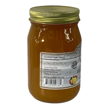 Broke Man's Pantry all-natural mango jam in a glass jar with a gold lid, featuring a rustic label.