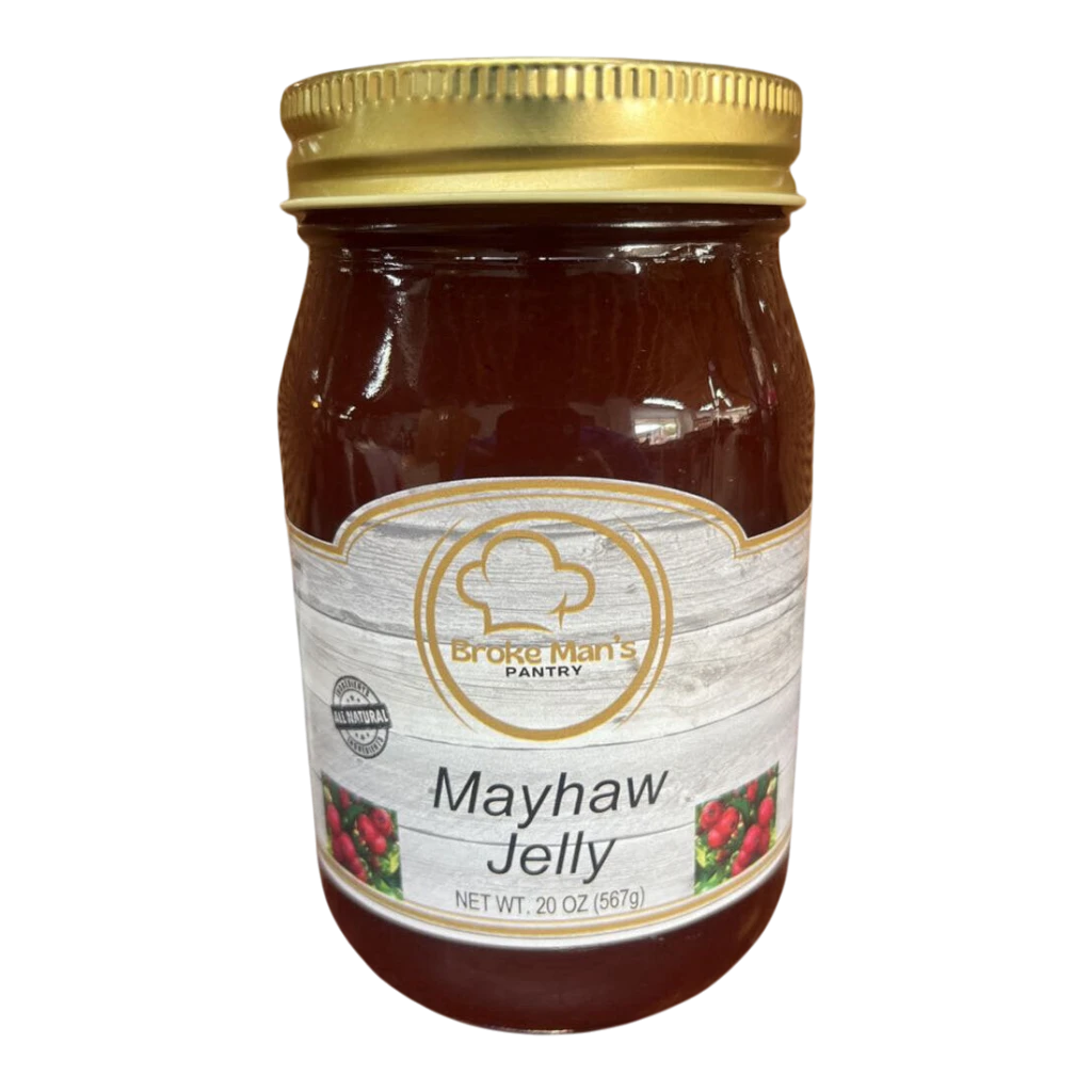 Broke Man's Pantry all-natural mayhaw jelly in a 20 oz glass jar with a gold lid and rustic wood-grain label.