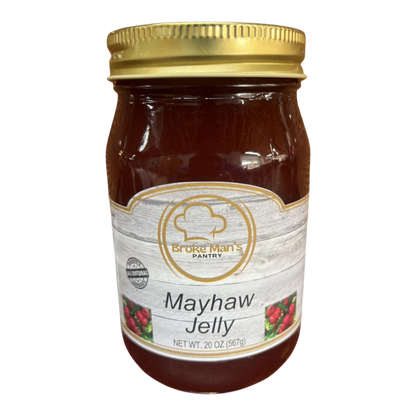 Broke Man's Pantry all-natural mayhaw jelly in a 20 oz glass jar with a gold lid and rustic wood-grain label.