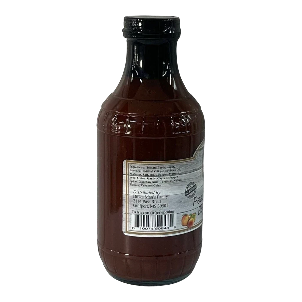 Broke Man's Pantry Peach Bourbon BBQ Sauce in a glass bottle with a detailed ingredient label on a black background.