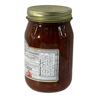 Broke Man's Pantry medium pineapple bacon salsa in a glass jar with a gold lid against a black background.