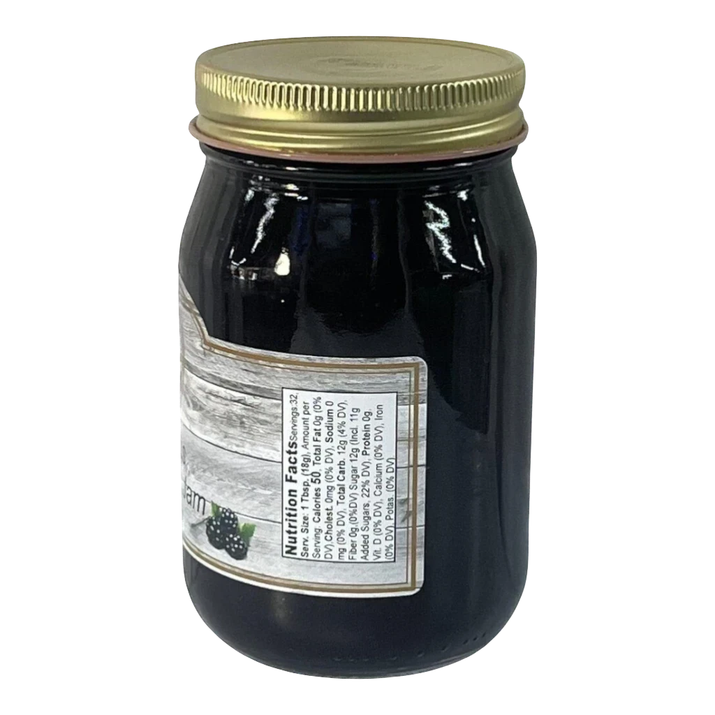 Broke Man's Pantry seedless blackberry jam in a glass jar with a gold lid, showing nutrition facts label.