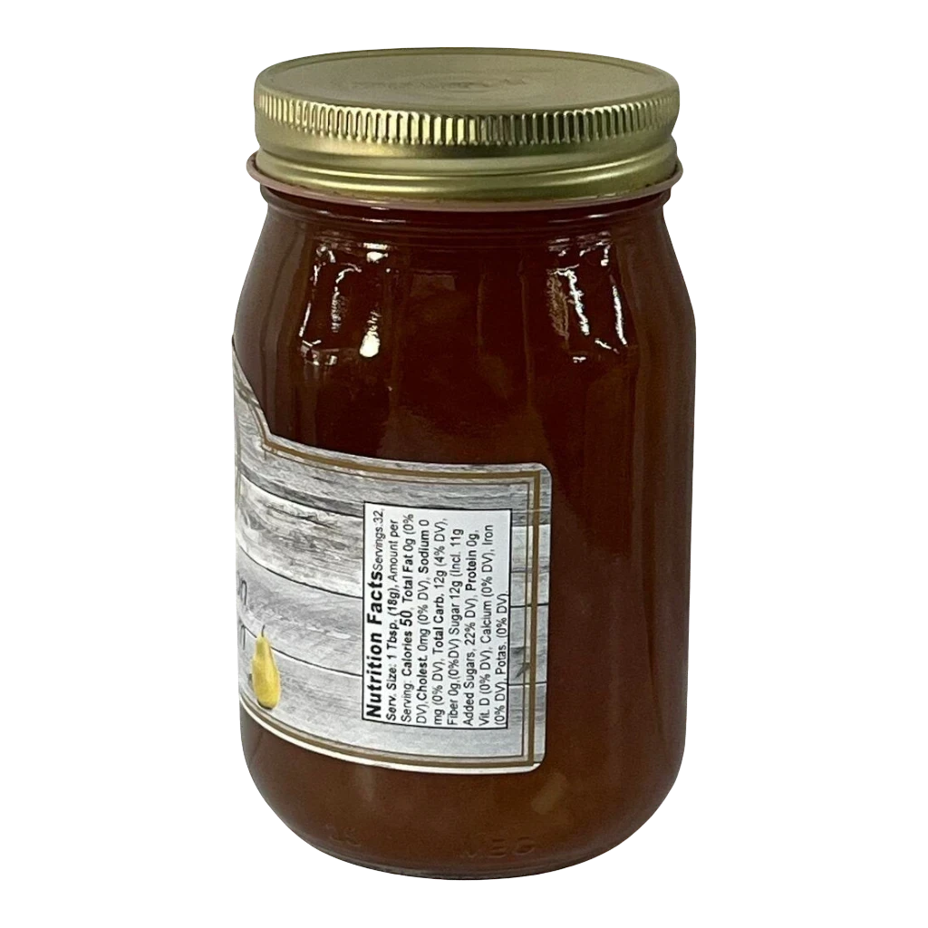 Broke Man's Pantry Cinnamon Pear Jam in a glass jar with a gold lid. The label features a pear illustration and nutrition facts.